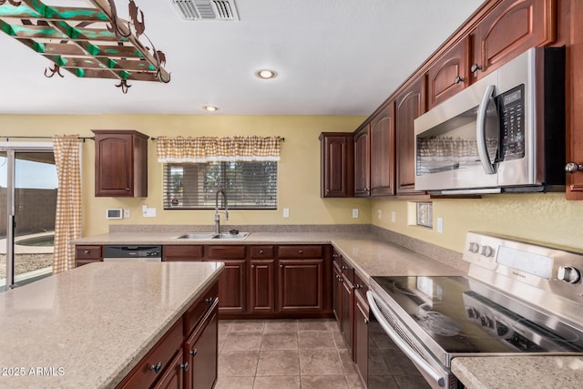 22123 E Via Del Palo, Queen Creek, AZ 85142 - kitchen with appliances with stainless steel finishes, a sink, recessed lighting, light tile patterned floors, and visible vents