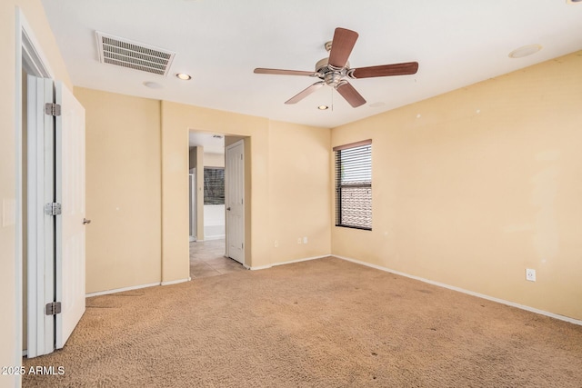 22123 E Via Del Palo, Queen Creek, AZ 85142 - unfurnished bedroom with visible vents, baseboards, and light colored carpet