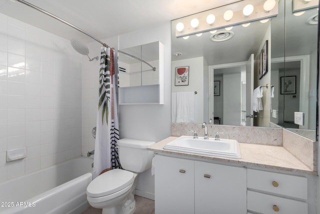 full bathroom with vanity, shower / bath combo with shower curtain, and toilet