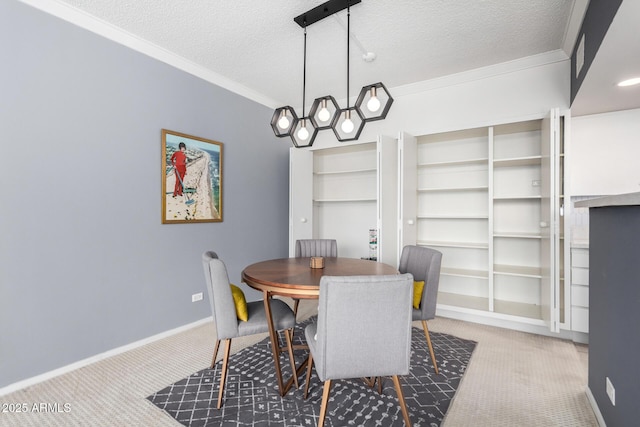 dining room featuring crown molding, carpet floors, and a textured ceiling