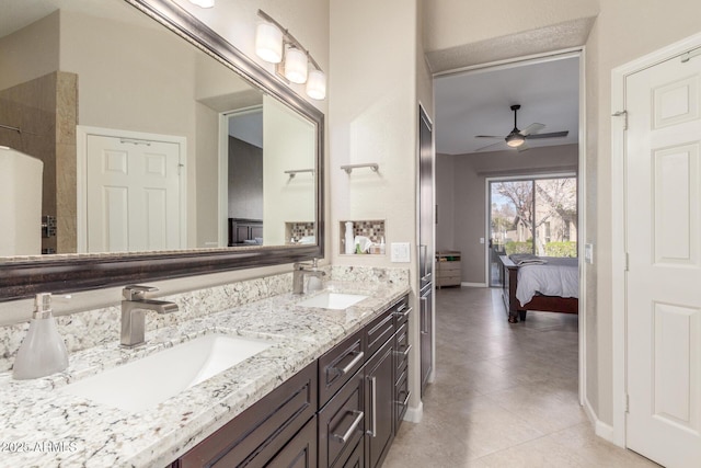 bathroom with ceiling fan, vanity, and tile patterned floors