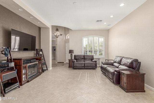 living room featuring an inviting chandelier