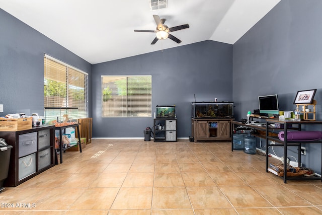 tiled office space featuring vaulted ceiling and ceiling fan