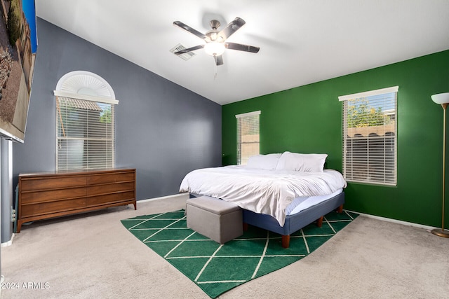 bedroom with ceiling fan and dark colored carpet