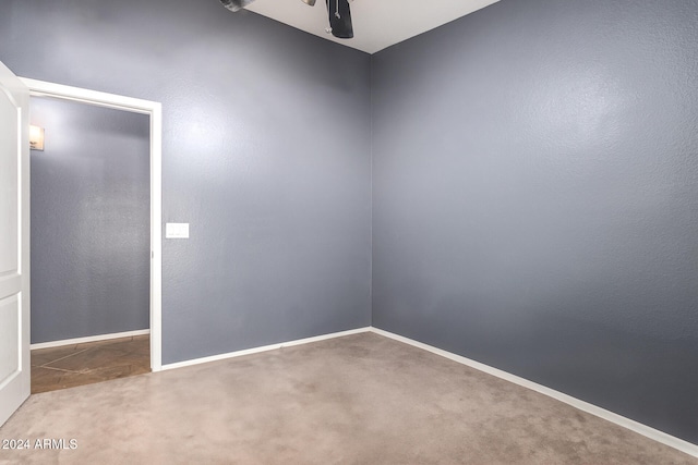 carpeted empty room with ceiling fan