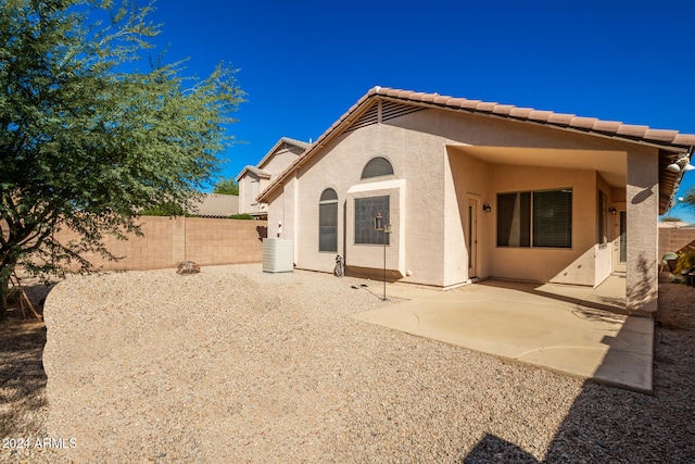 rear view of property featuring a patio area