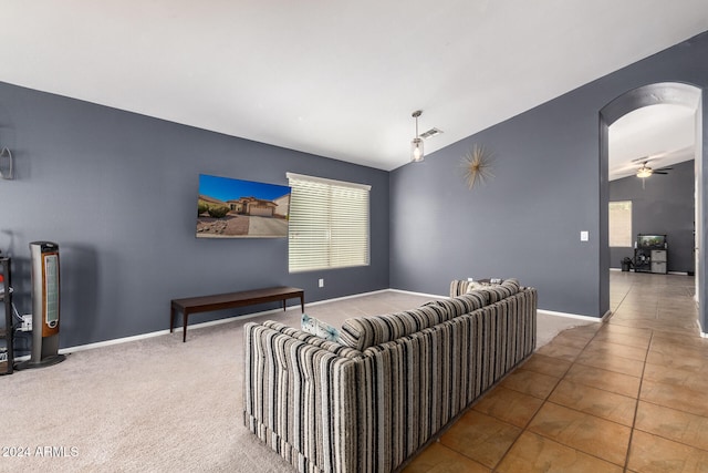 living room with tile patterned floors and ceiling fan