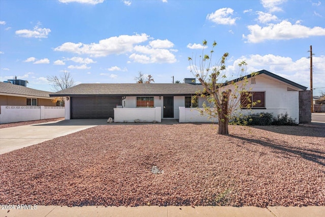 ranch-style house with a garage