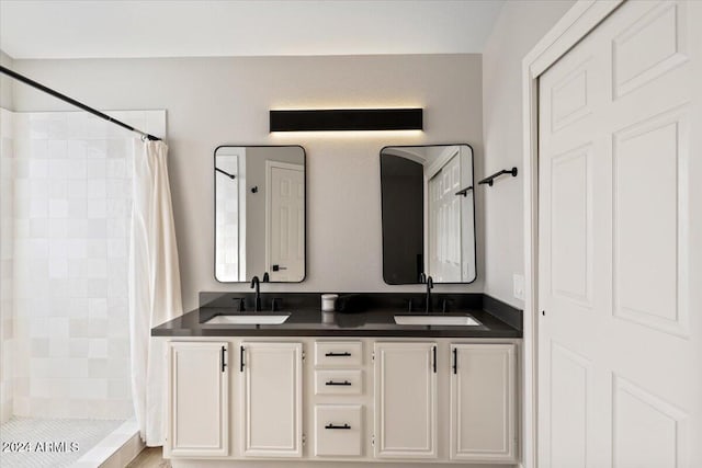 bathroom with vanity and curtained shower