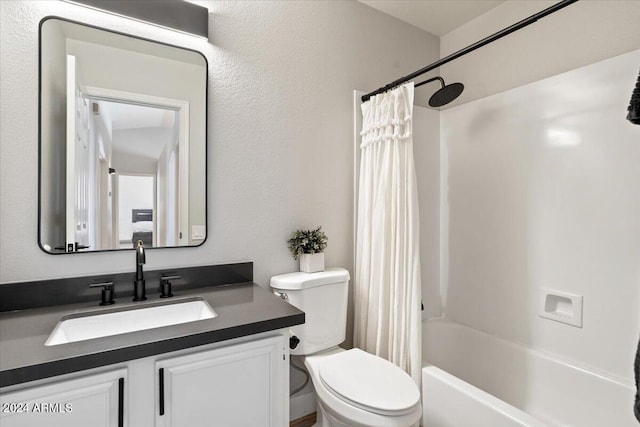 full bathroom with shower / bath combo, vanity, and toilet