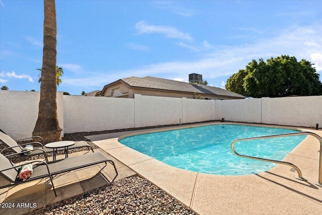 view of swimming pool with a patio