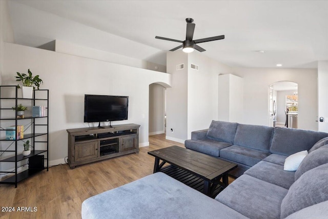 living room with hardwood / wood-style floors and ceiling fan