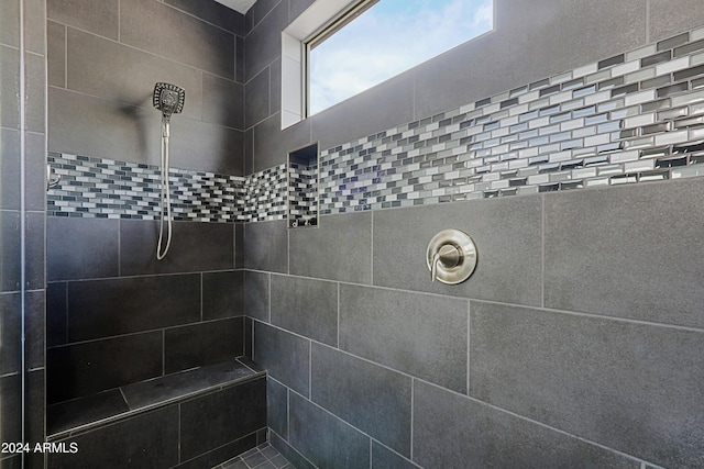 bathroom with tiled shower