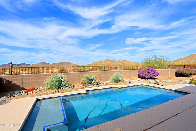 view of pool with a mountain view