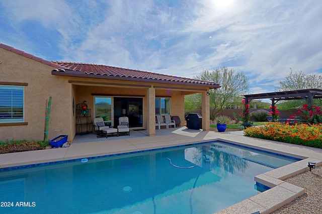 view of swimming pool with a pergola, a patio, and grilling area