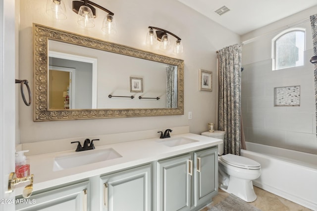 full bathroom featuring vanity, shower / tub combo, and toilet