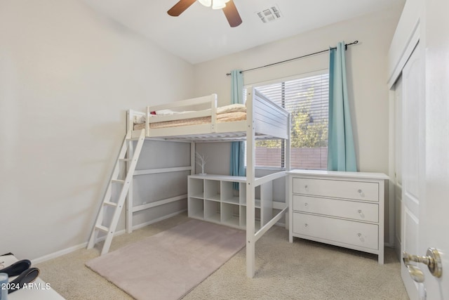 bedroom with ceiling fan and light colored carpet