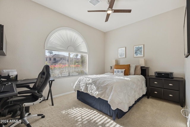 carpeted bedroom featuring vaulted ceiling and ceiling fan