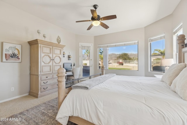 bedroom with ceiling fan and carpet