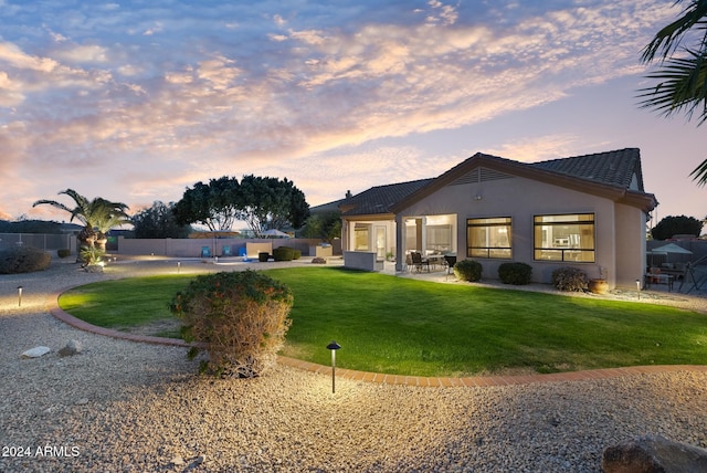 exterior space featuring a lawn and a patio