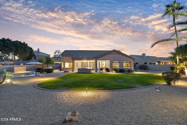 view of front of home with a yard