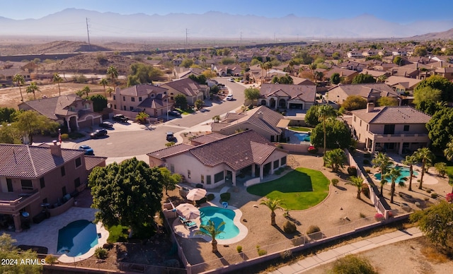 birds eye view of property featuring a mountain view