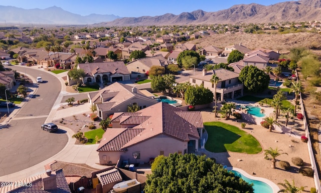 birds eye view of property with a mountain view