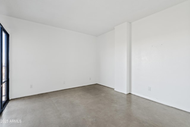 spare room with concrete flooring