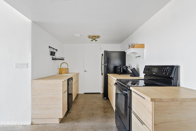 kitchen featuring a sink, light brown cabinetry, concrete flooring, black appliances, and open shelves