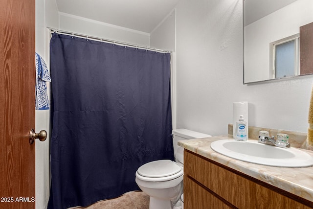 full bathroom with curtained shower, vanity, and toilet