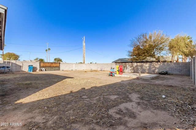 view of yard with a fenced backyard