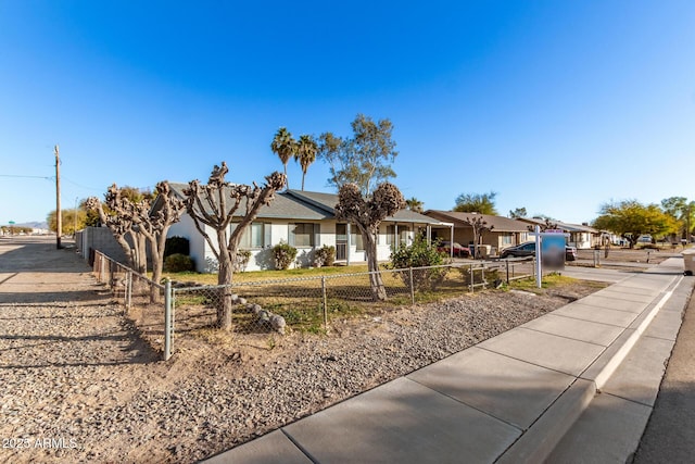 view of front facade featuring a fenced front yard and a residential view