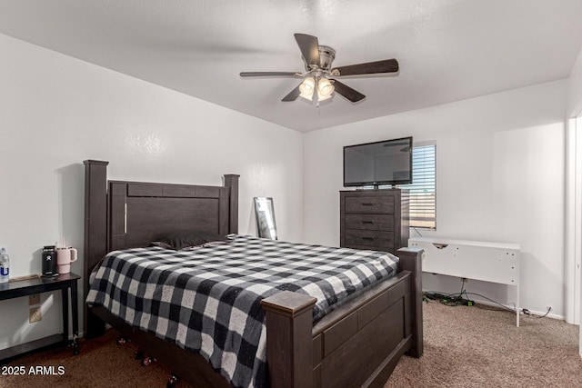 bedroom featuring a ceiling fan and carpet