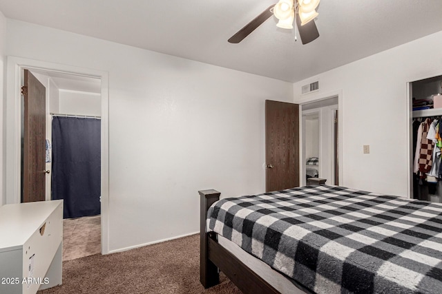 carpeted bedroom with a ceiling fan, a closet, and visible vents