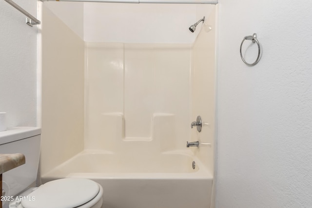 full bathroom with shower / bath combination and toilet