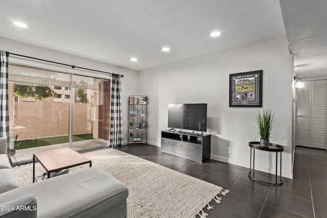 living room featuring dark tile patterned floors