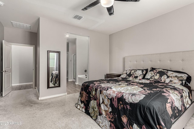 carpeted bedroom featuring ceiling fan, baseboards, and ensuite bath