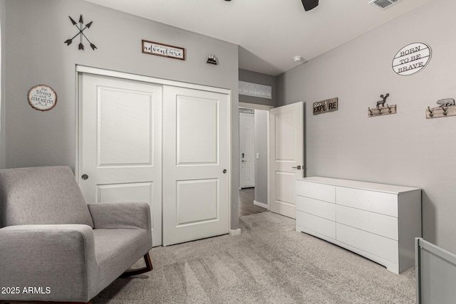 sitting room featuring carpet flooring