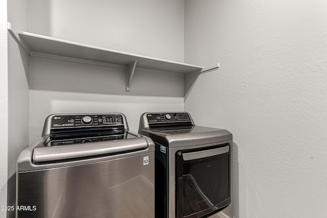 washroom with independent washer and dryer