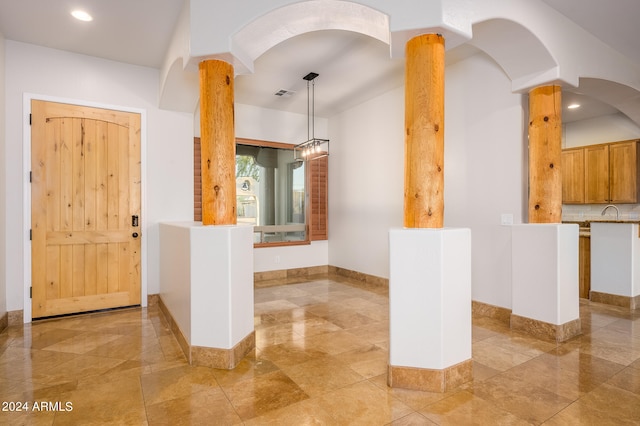 interior space with sink and ornate columns