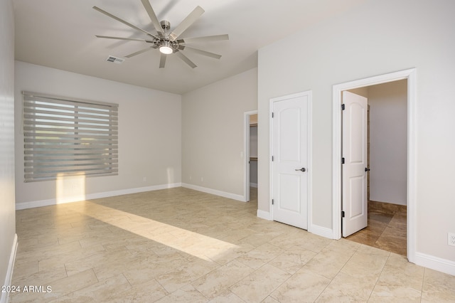 unfurnished room with ceiling fan