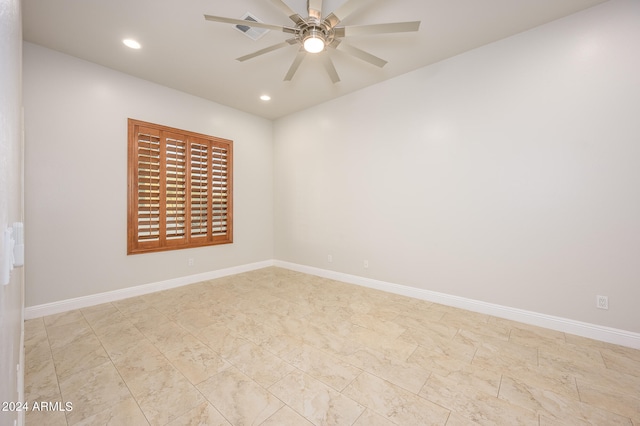 spare room with ceiling fan