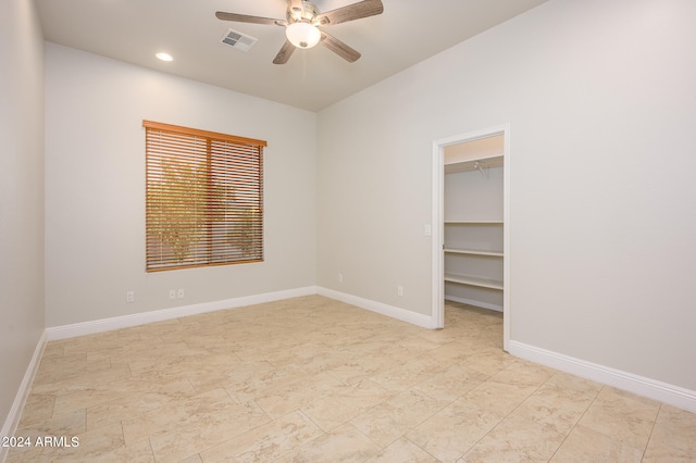 unfurnished room with ceiling fan