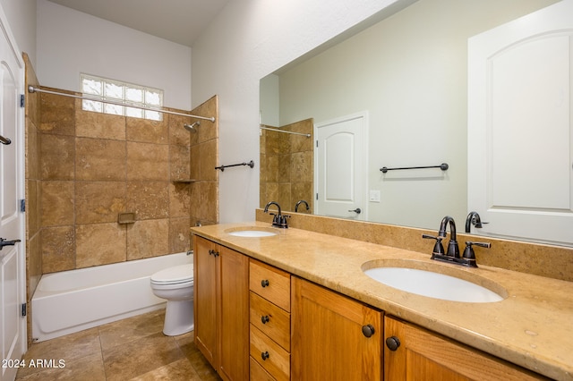 full bathroom with vanity, toilet, and tiled shower / bath