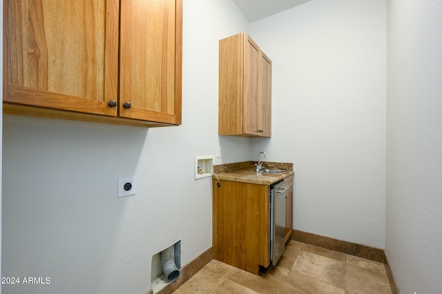 laundry area featuring hookup for a washing machine, hookup for an electric dryer, sink, and cabinets