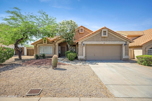 4131 E Cascalote Dr, Cave Creek, AZ 85331 - view of front facade featuring a garage, concrete driveway, stucco siding, and a tiled roof