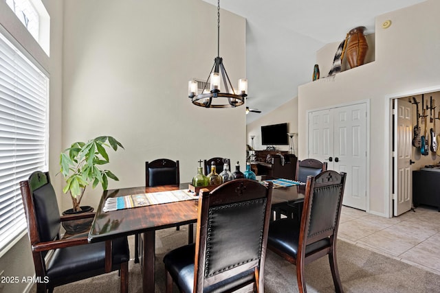 4131 E Cascalote Dr, Cave Creek, AZ 85331 - dining space featuring a chandelier, high vaulted ceiling, and light tile patterned floors