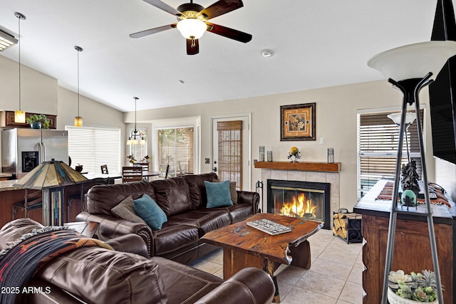 4131 E Cascalote Dr, Cave Creek, AZ 85331 - living area featuring lofted ceiling, ceiling fan, a tile fireplace, and light tile patterned floors