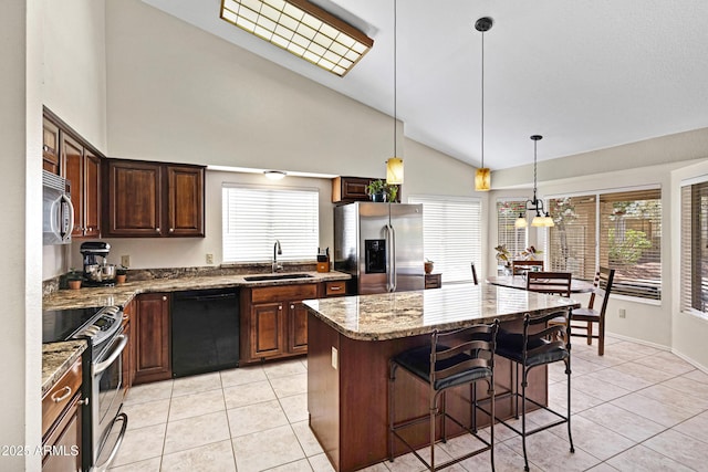 4131 E Cascalote Dr, Cave Creek, AZ 85331 - kitchen featuring stainless steel appliances, light tile patterned floors, plenty of natural light, and high vaulted ceiling