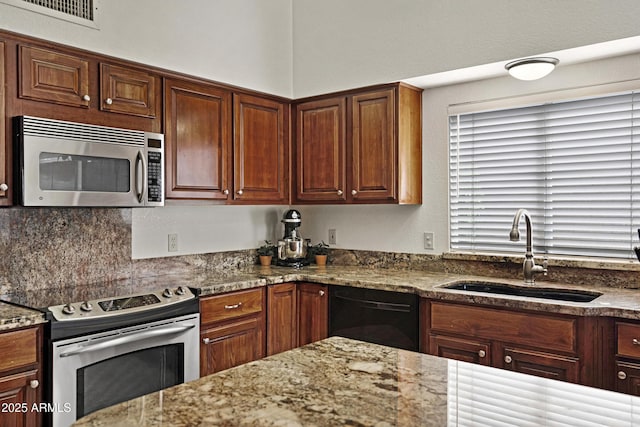 4131 E Cascalote Dr, Cave Creek, AZ 85331 - kitchen featuring stainless steel appliances, light stone countertops, and tasteful backsplash